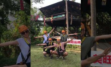A group of people wearing safety gear while ziplining in Chiang Mai.
