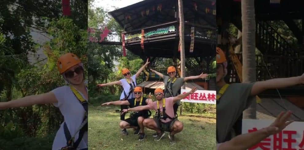 A group of people wearing safety gear while ziplining in Chiang Mai.